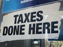 A sign advertising services hangs at the tax collector's office in Chicago, Illinois, on April 15, 2024.